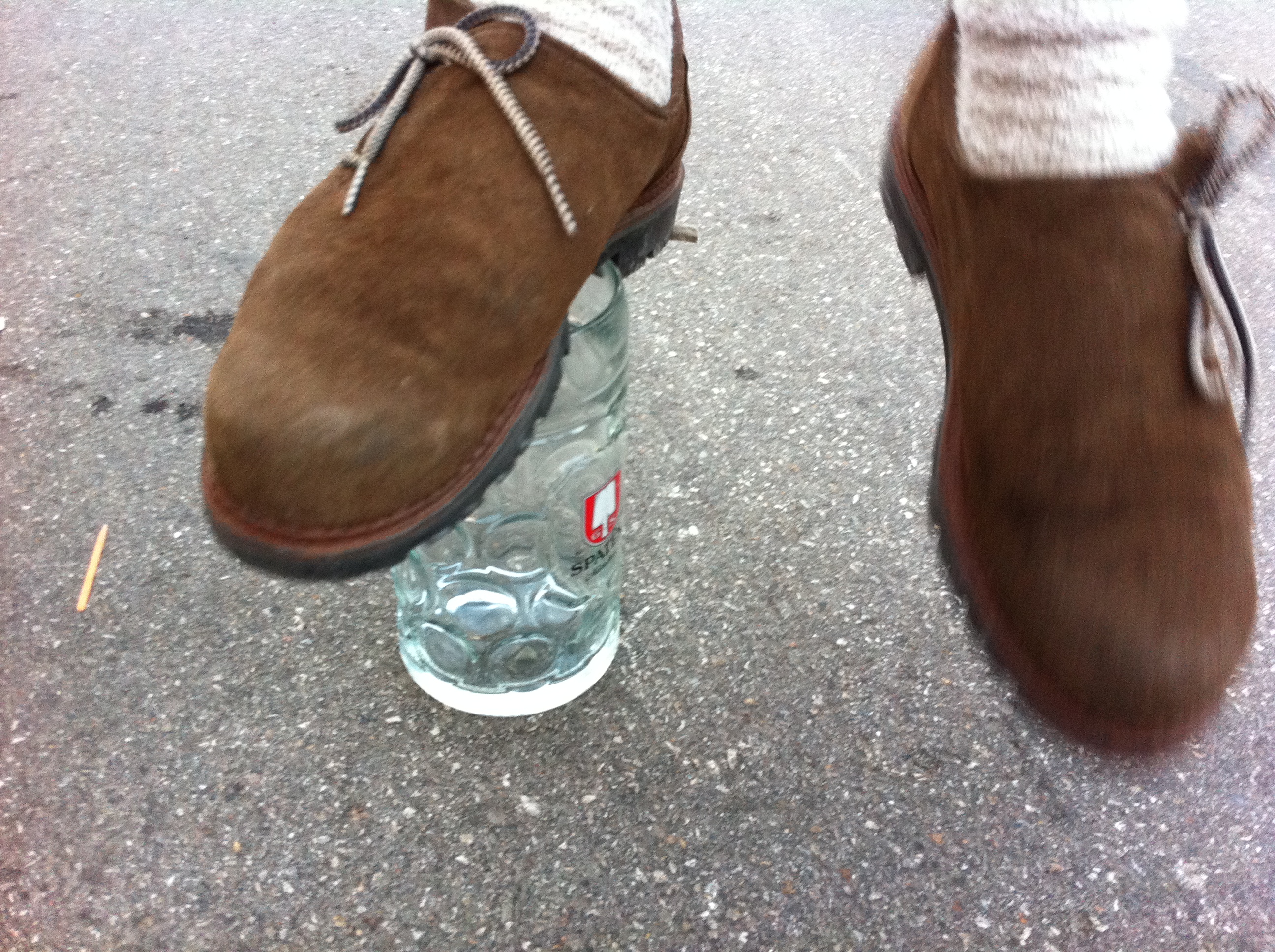 Guy stands on a beer glass