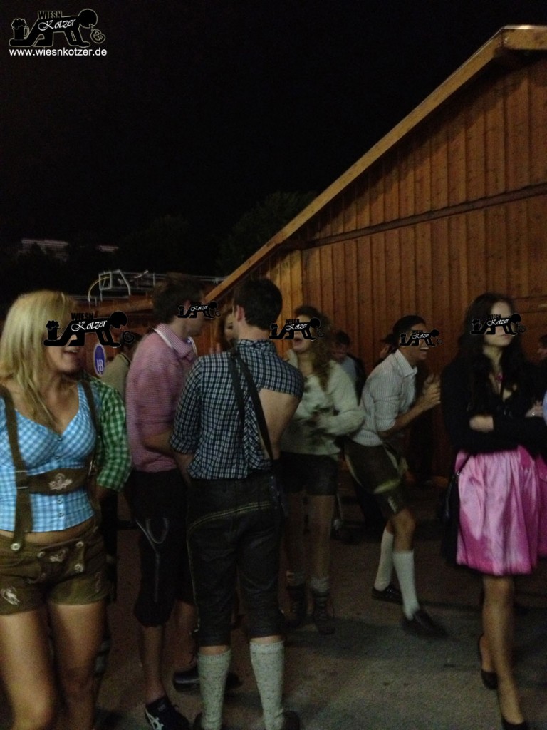 ripped shirt guy and sexy tummy shirt girl at the Oktoberfest